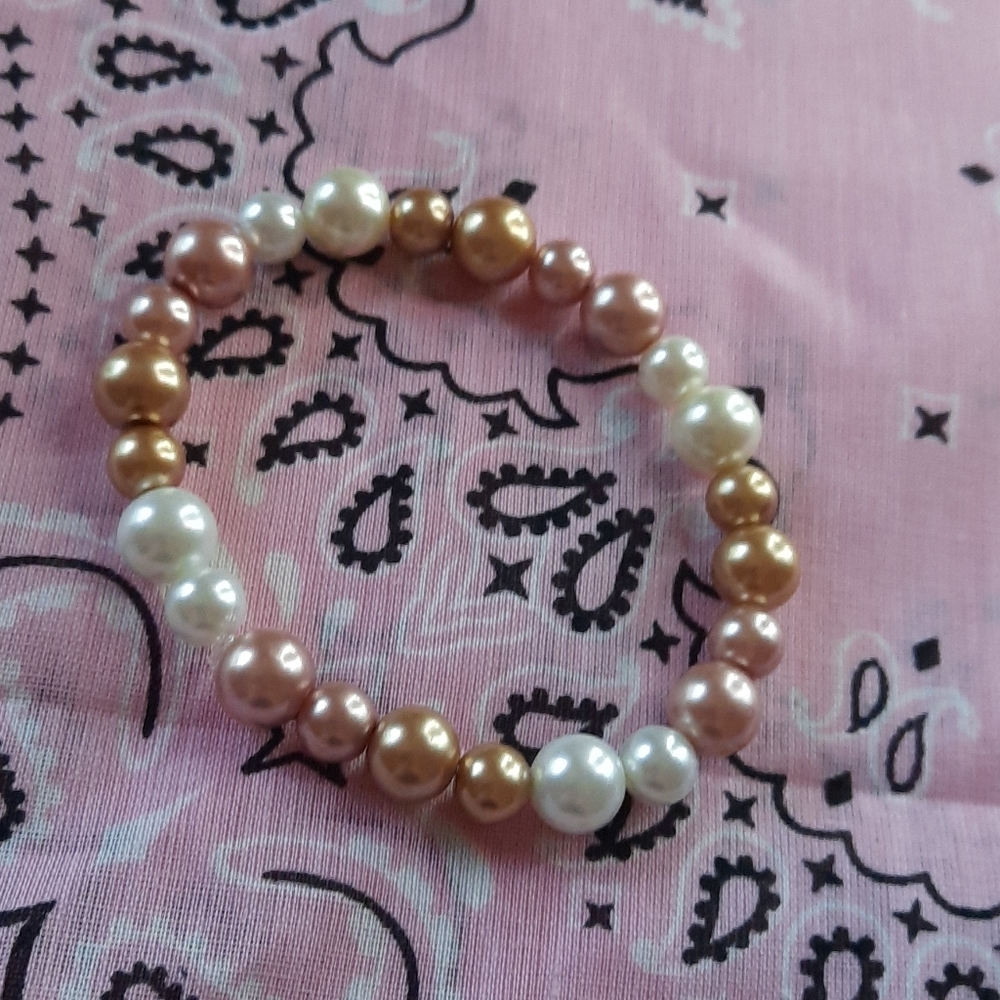 Gold, rose gold, and white pearl bracelet